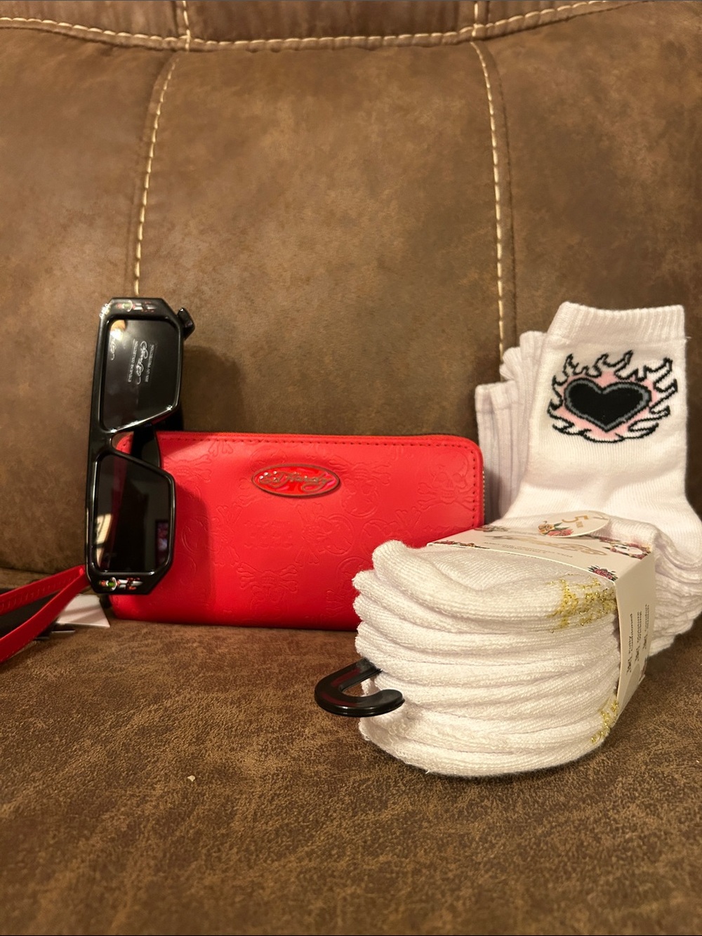 Red embossed wristlet wallet with black sunglasses and new 5 pack of socks 🧦
